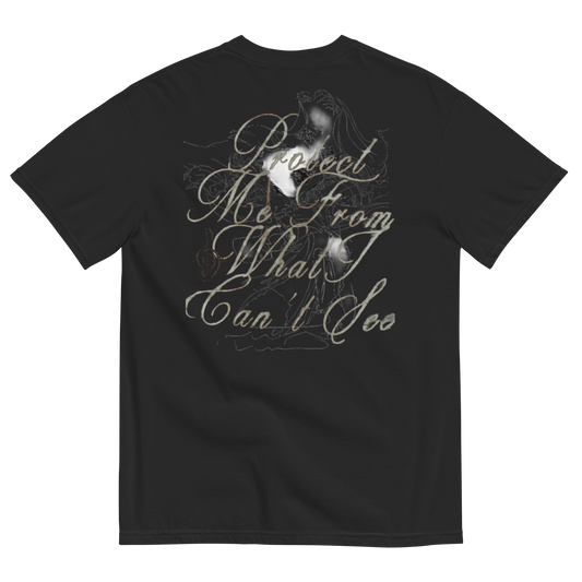 Black short-sleeve t-shirt showing the back side with a large graphic print. The graphic features a sketch of a woman with long hair, a musical staff line, and cursive text reading 'Dreaming From What I Can't See' in a muted gray-green color.