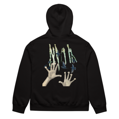 Black hoodie with artistic design on the back featuring hands and abstract elements.