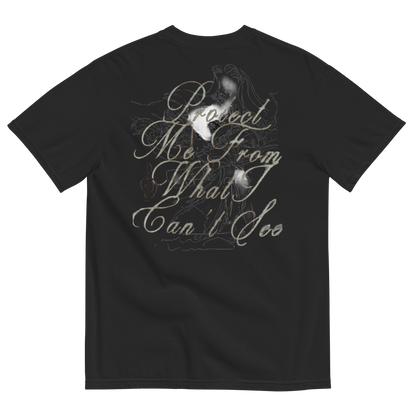 Black short-sleeve t-shirt showing the back side with a large graphic print. The graphic features a sketch of a woman with long hair, a musical staff line, and cursive text reading 'Dreaming From What I Can't See' in a muted gray-green color.