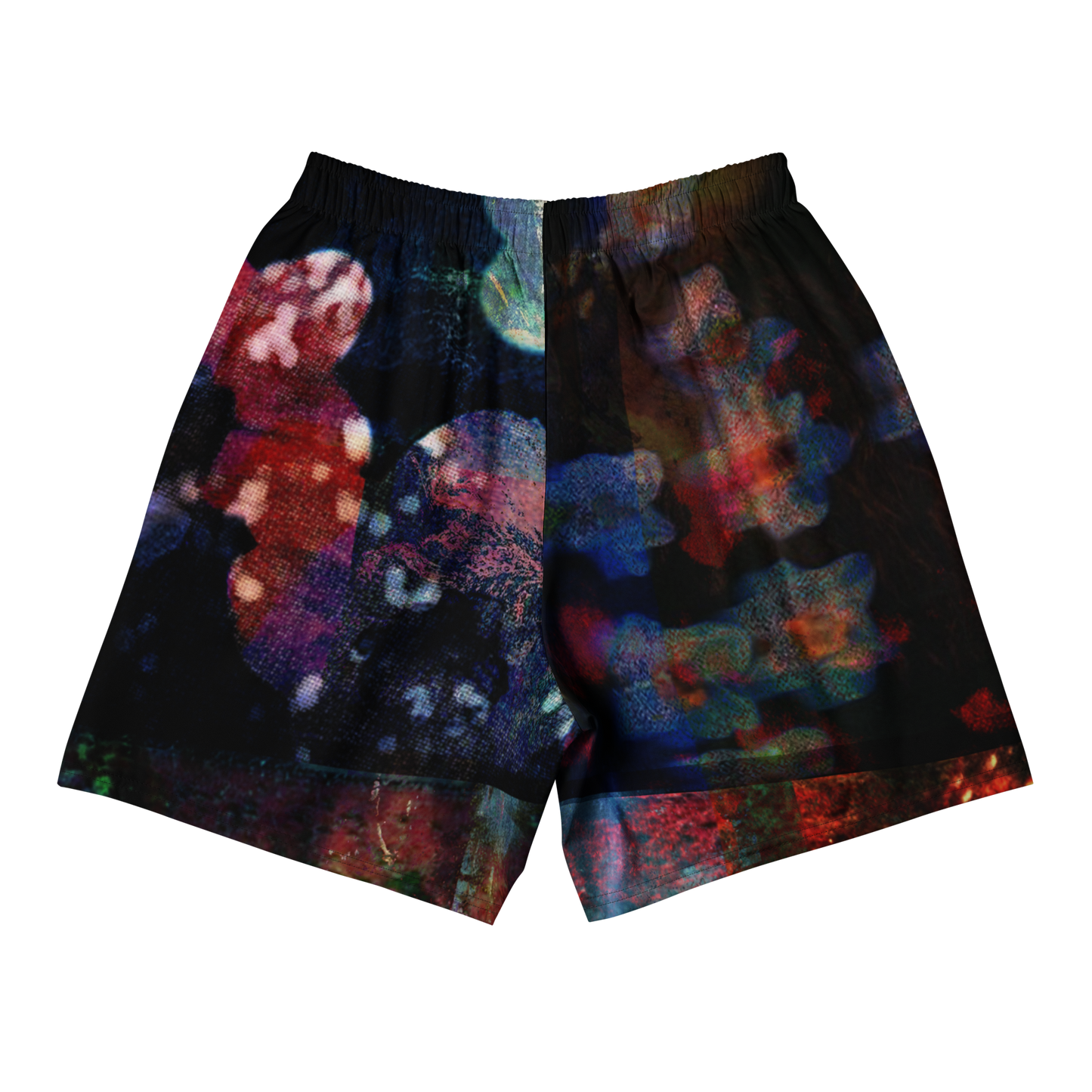 A pair of athletic shorts featuring an all-over abstract, multicolored print on a black base, shown flat against a solid white background.