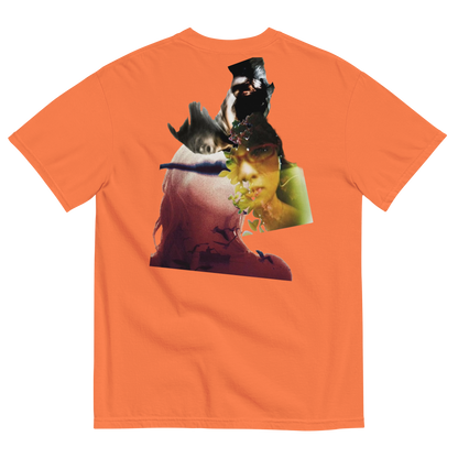 Orange t-shirt with a graphic design of a person's face and animals on a white background