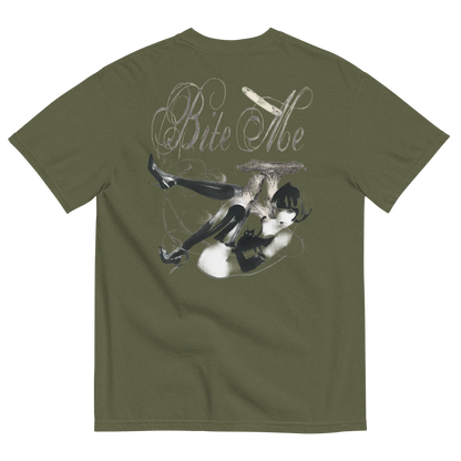 An olive green short-sleeve t-shirt shown from the back, featuring a large graphic print of a woman in black thigh-high stockings and a cat on her back with the text 'Bite Me' in a stylized font.