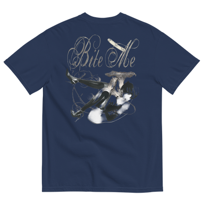 A navy blue short-sleeve t-shirt shown from the back, featuring a large graphic print of a woman in a black dress with a cigarette holder and the text 'Bite Me' in a stylized white font.