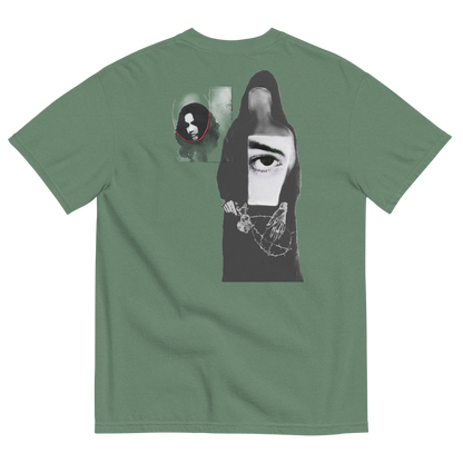 Green t-shirt with abstract design of ladies with misplaced faces and black and white elements 