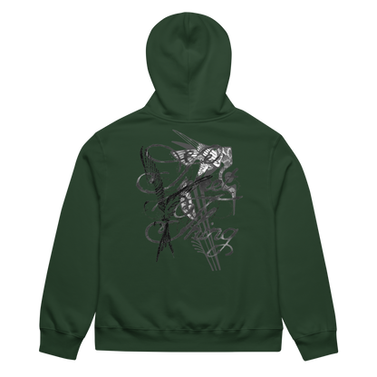 A dark green hoodie shown from the back, featuring a large, detailed black and gray graphic print of a winged dagger and occult symbols across the center.